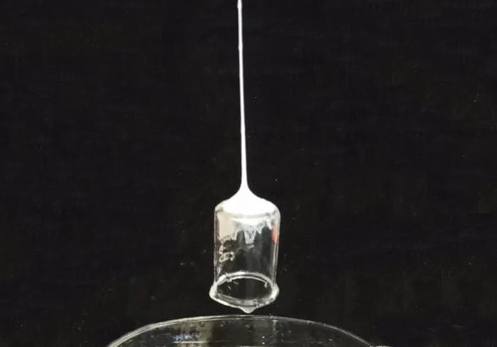 Silk fiber lift a beaker.